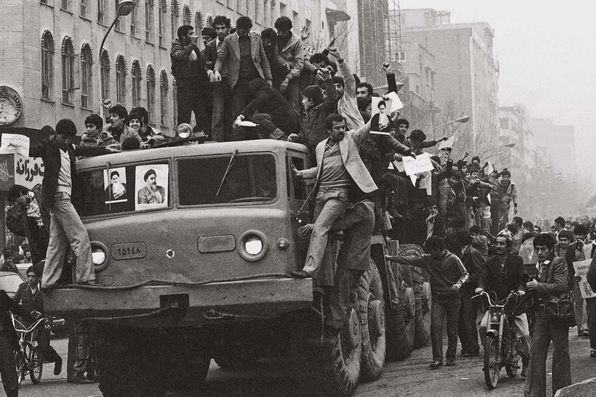  Dozens of demonstrators who have invaded an Iranian army truck, downtown on Wednesday, Jan. 17, 1979 in Tehran proceed in their joyful demonstration on the second day after the Shah‘s departure. 